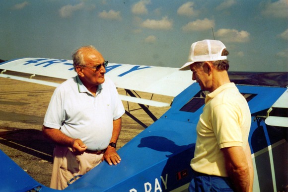 Ray talking to a colleague 